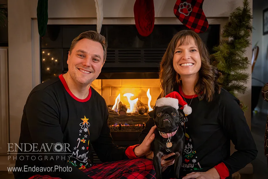family christmas photo in front of fireplace